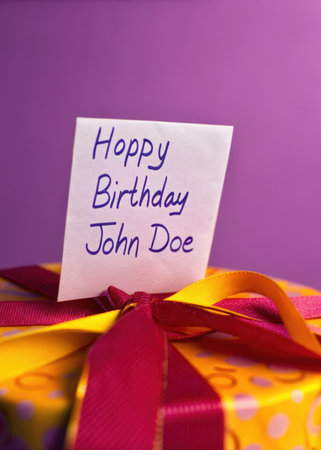 a birthday present with a note on itの素材