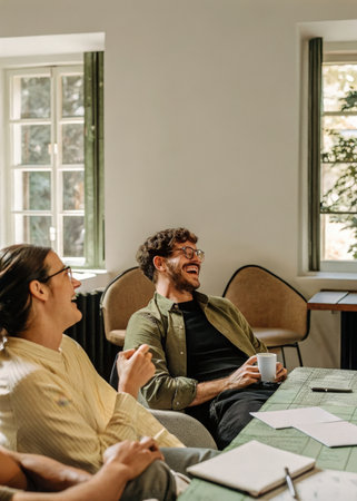 a man and woman sitting at a tableの素材