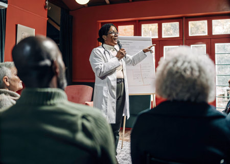 African american doctor giving a presentation to a group of senior peopleの素材
