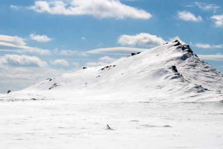 mountain top and slope in the snowの写真素材