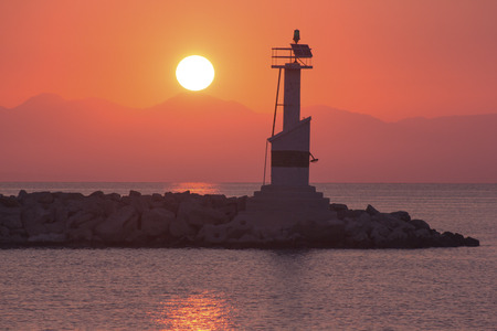 Port of Zakynthos town lighthouse  in the sunrise shiningの写真素材