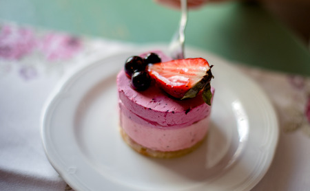The cake in a cafe. Cake with strawberries and currants.の写真素材