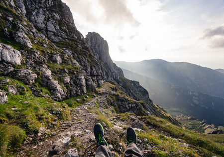 Person standing on the rock. Mountains Bucegi, Romania. Summer day.の写真素材