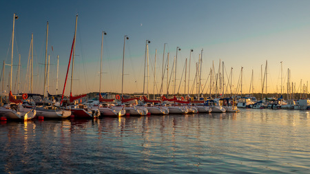 Vistula river with sailboats at the marina of the National Sailing Center in the evening. Gorki West, Gdansk.のeditorial素材