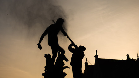 Silhouette of Neptune fountain in sunrise, Gdansk, Poland.