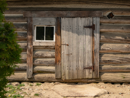 A facade of old wooden house.の写真素材