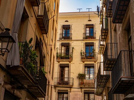 Common street in Barcelona. Classic apartment building in old town.の写真素材
