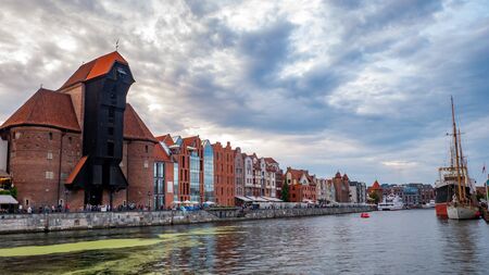 City Gdansk with the oldest medival crane port called Zuraw and a promenade along the riverbank of Motlawa River.の写真素材