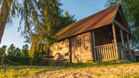 Brown Wooden Garden House at sunset.の写真素材
