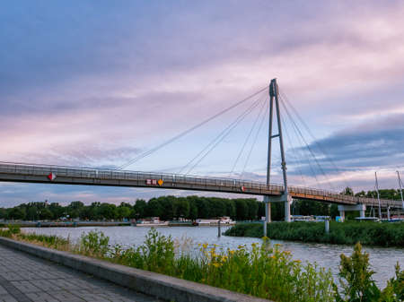 Modern pedestrian bridge In Gizycko Port during sunrise, Poland.の写真素材