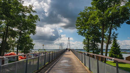 Modern pedestrian bridge In Gizycko Port during sunrise, Poland.の写真素材