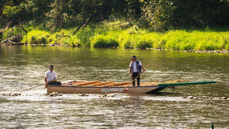 Szczawnica, Poland - September 11, 2020. Typical polish raftsmans on the Dunajec river. The rafting is very popular tourist attraction in Pieniny mountains.のeditorial素材