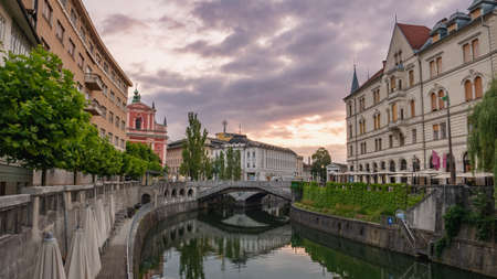 View of the Triple Bridge, Ljubljana, Slovenia shortly after sunrise.の写真素材