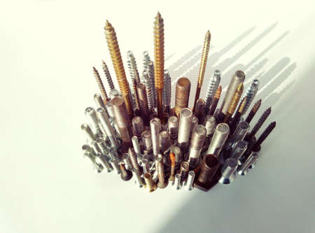 The iron city of screws and bolts casts a shadow in creative and abstract macro photography