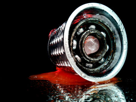 bearing in a metal shredder with ice in the dark in a creative photo fantasyの写真素材