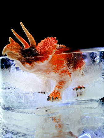 creative photo of a dinosaur frozen in iceの写真素材