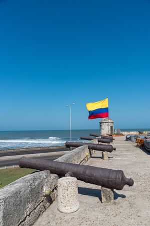 Wall of Cartagena with old cannons and flag of Colombia. Colombiaの写真素材