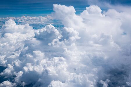 aerial view of clouds blue sky envelopes in a flight over colombia