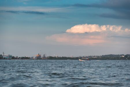 motor boat transporting passengers through the bay of Cartagena before nightfall as boats can not circulate in the area of the bay at dusk. Colombiaの写真素材