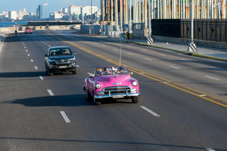Classical convertible taxi in Malecon Avenue in Havana, this type of transportation has become an attraction for tourists visiting the island. Havana. Cuba February 2, 2019.のeditorial素材