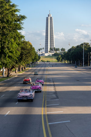 Excursions in classic taxis convertible through the avenues of Havana. One of the most common activities in the streets of the city. Havana. Cuba. January 2, 2019のeditorial素材