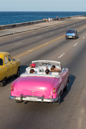 Classical convertible taxi in Malecon Avenue in Havana, this type of transportation has become an attraction for tourists visiting the island. Havana. Cuba February 2, 2019.のeditorial素材