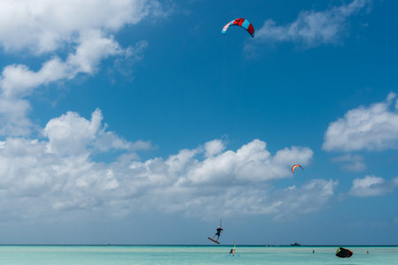 Kiteboarding is common this sport on the beaches of Aruba. Where you see many learning like others who have total control of the discipline. Hadicurari beach. Aruba February 24, 2019のeditorial素材