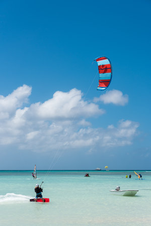 Kiteboarding is common this sport on the beaches of Aruba. Where you see many learning like others who have total control of the discipline. Hadicurari beach. Aruba February 24, 2019のeditorial素材