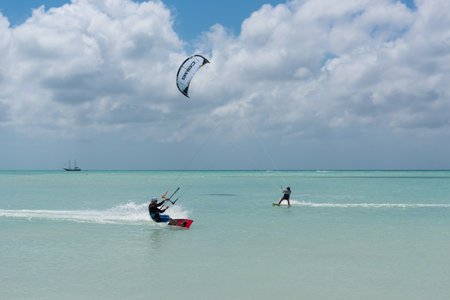 Kitesurfing is common on the beaches of Aruba due to the winds that are available almost all year round on the island. Hadicurari beach. Aruba February 24, 2019.のeditorial素材