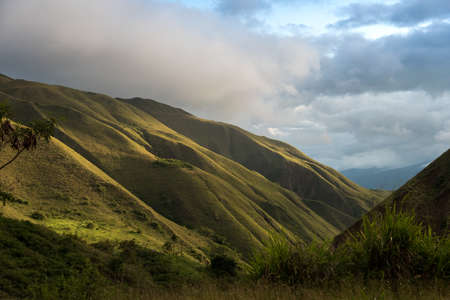 Green mountains with light at sunset. Colombia.の写真素材