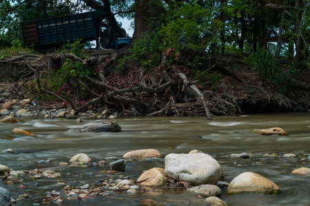Small river in a tropical forest landscape in Colombia.の写真素材