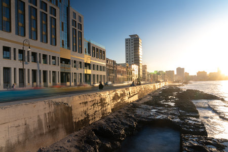 Sunset on the malecÃ³n avenue in old havana with cars passing in low exposure photography. Havana. Cuba. January 6, 2020.のeditorial素材