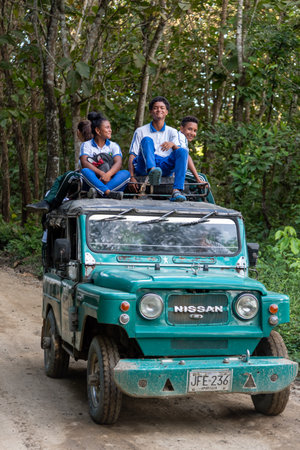 typical Colombian rural transport car with young people who go to school. San Jose de Apartado. Antioquia. Colombia November 19, 2019.のeditorial素材