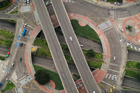 Car bridge over roundabout on avenida 100, an avenue that is very busy with people and passersby....