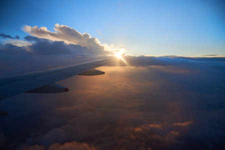 View from an airplane of a sunset between the clouds in the Colombian sky.の写真素材