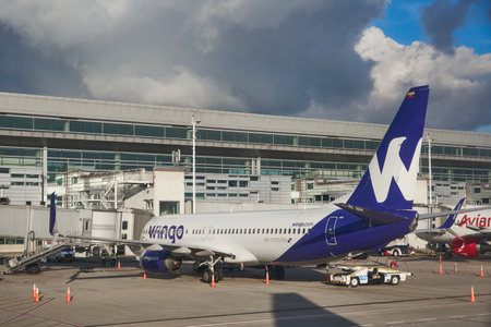 Wingo Airline plane parked in front of an El Dorado airport building. Bogota. Colombia. December 13,...
