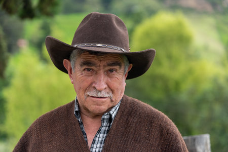 Farmer looking at the camera with a hat and a ruana, a very used clothing in the Province of Valderrama. BoyacÃ¡ Department. Colombia. May 25, 2019のeditorial素材