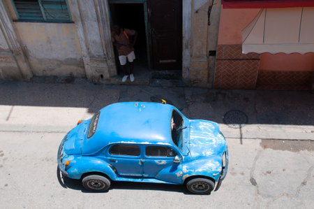 Small vintage car parked in front of a building on a street in old Havana. Havana. Cuba. May 12, 2015.のeditorial素材