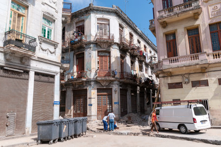Telephone company workers on a street in old Havana in some canals in the middle of the street. Havana. Cuba. May 14, 2015.のeditorial素材