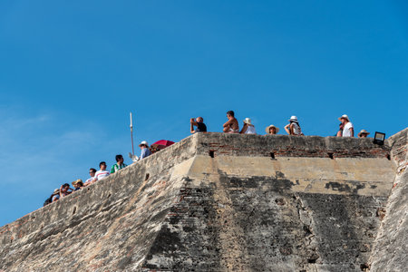 Tourists on the wall of the San Felipe castle in the city of Cartagena. This fortification is one of the museums of the Spanish colonial era in the Americas. CArtagena. Colombia. April 24, 2019.のeditorial素材