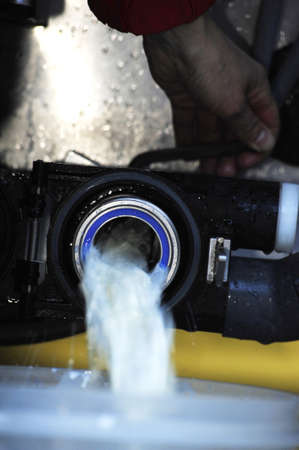 cow milk coming out of a pipeの写真素材