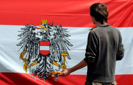 man standing in front of austrian flagの写真素材