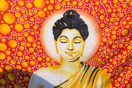 Portrait of Buddha with red and golden elements