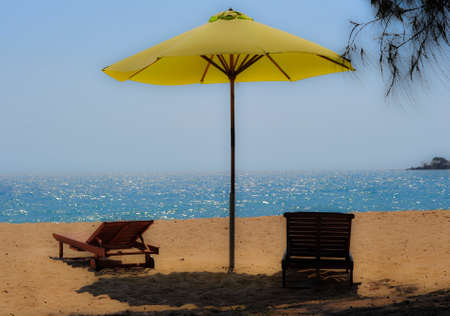 parasol and sunlounger at the beach in vietnamの写真素材