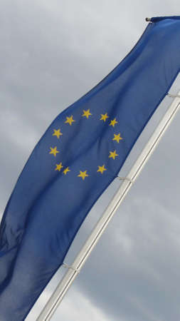 EU flag, gray sky backgroundの写真素材