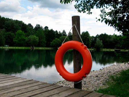 Lifebuoy at jetty near water