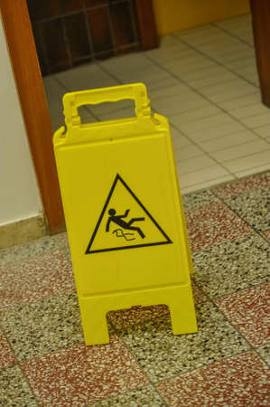 Yellow slippery floor sign, indoorsの写真素材