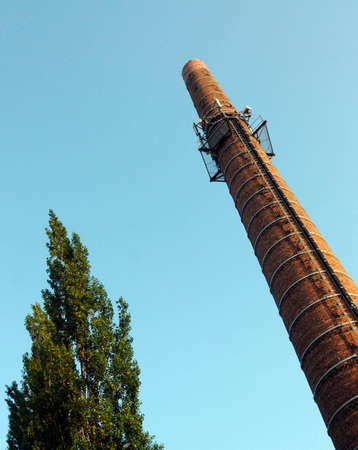 Factory chimney with sky backgroundの写真素材