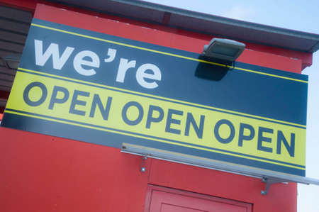We're open sign on shop front