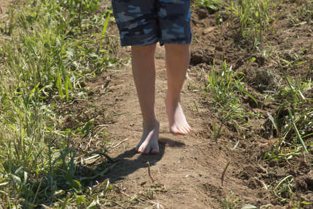 barefoot, without any footwear